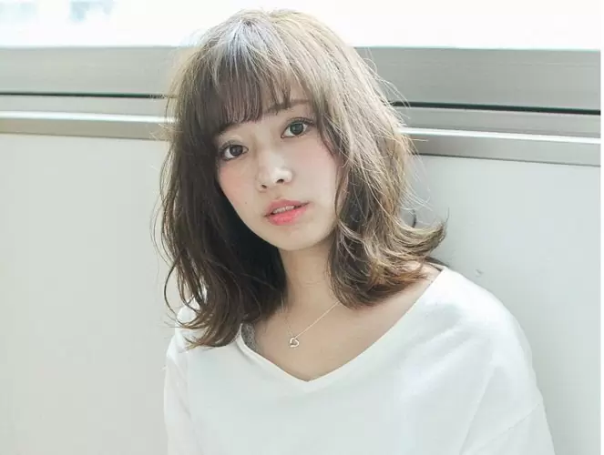Mẫu tóc ngắn xoăn sóng đuôi